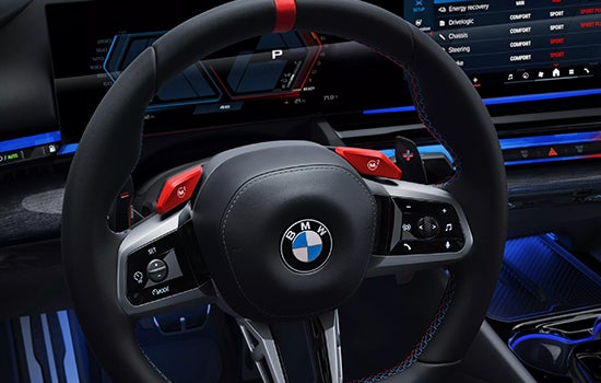 Close-up view of BMW M5 Touring steering wheel. | BMW of Westbrook in Westbrook ME