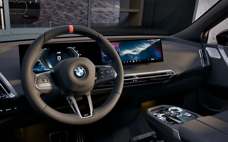 Interior steering wheel and dashboard of the BMW iX M70. | BMW of Westbrook in Westbrook ME