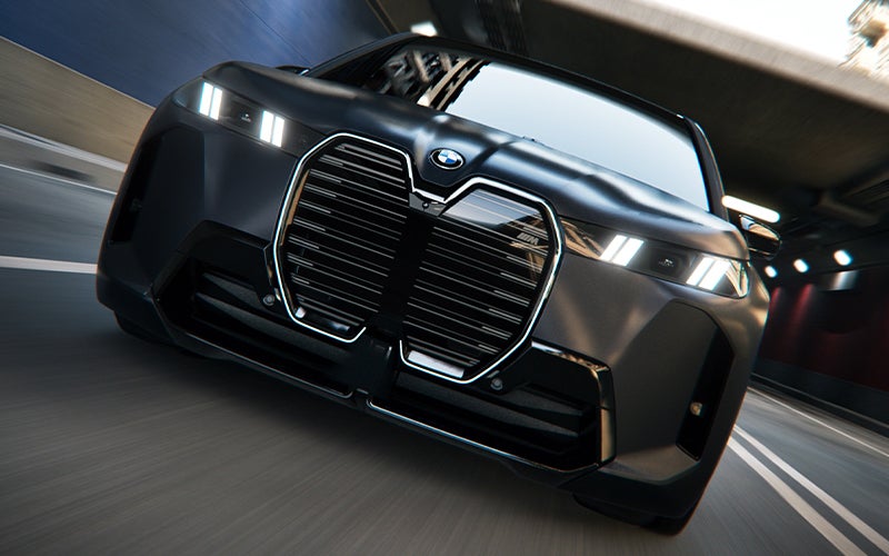The BMW iX M70 grill shown driving. | BMW of Westbrook in Westbrook ME